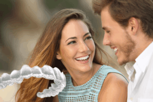 Smiling couple, illustrating an Invisalign treatment timeline